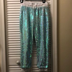 More Than Magic sequin-flip teal/white joggers.